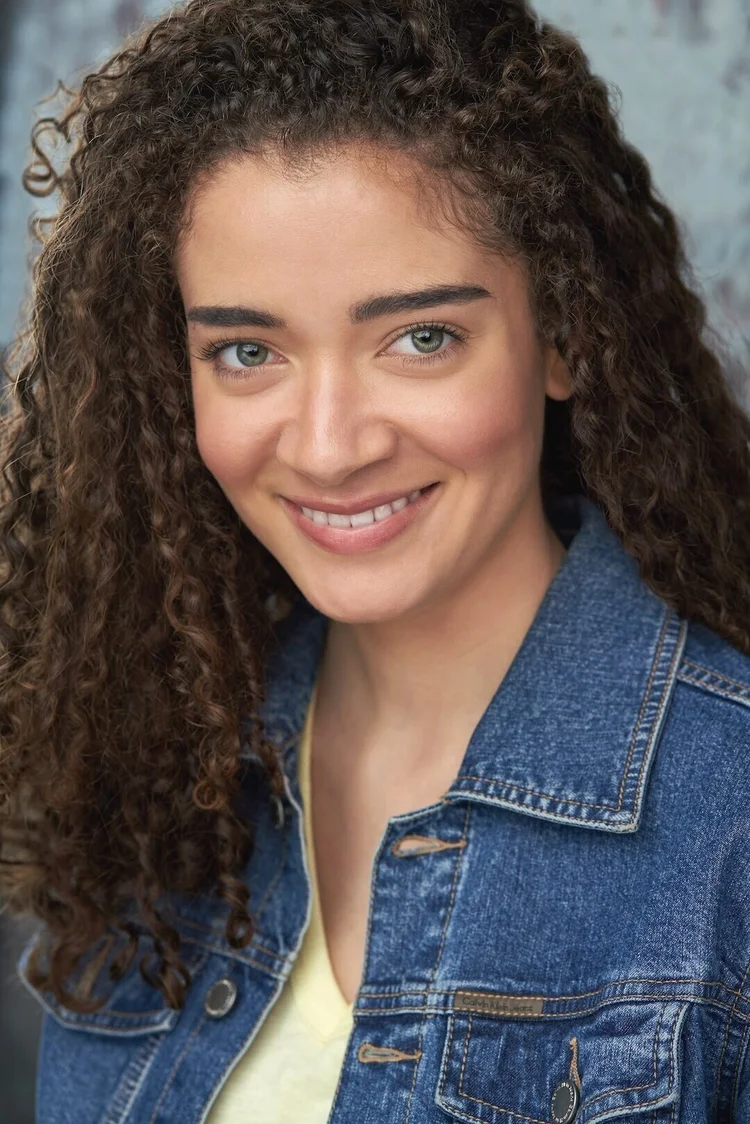 Editorial actor headshot of curly-haired actress in a denim jacket, photographed by an Atlanta actor headshot photographer