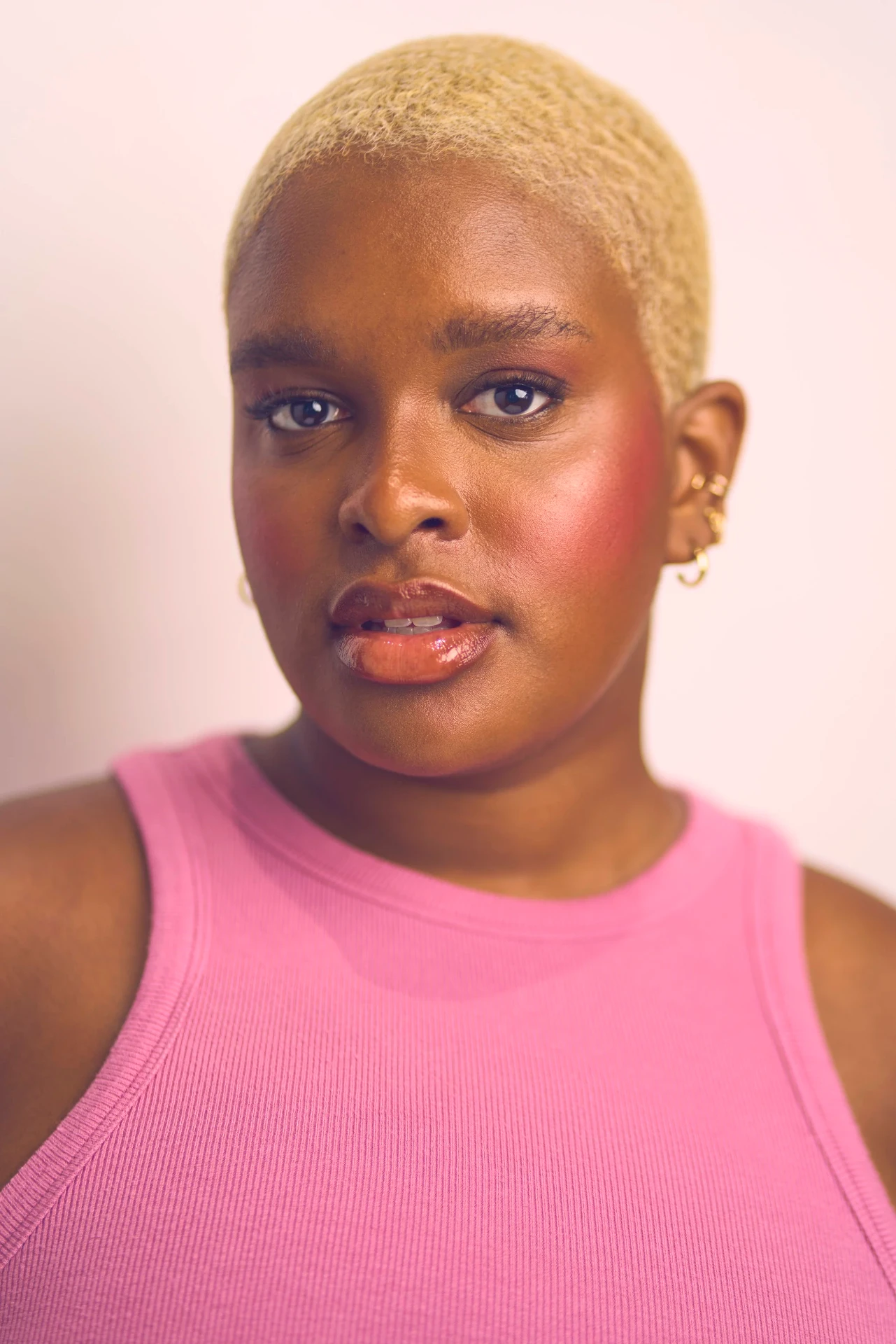 Editorial actor headshot of actress with platinum hair in a pink tank, photographed by an Atlanta actor headshot photographer