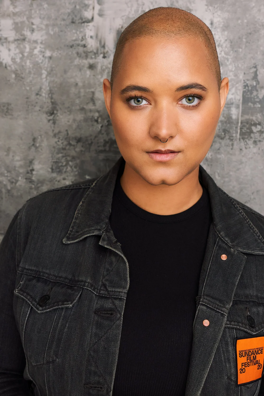 Theatrical actor headshot on a textured gray backdrop by an Atlanta actor headshot photographer