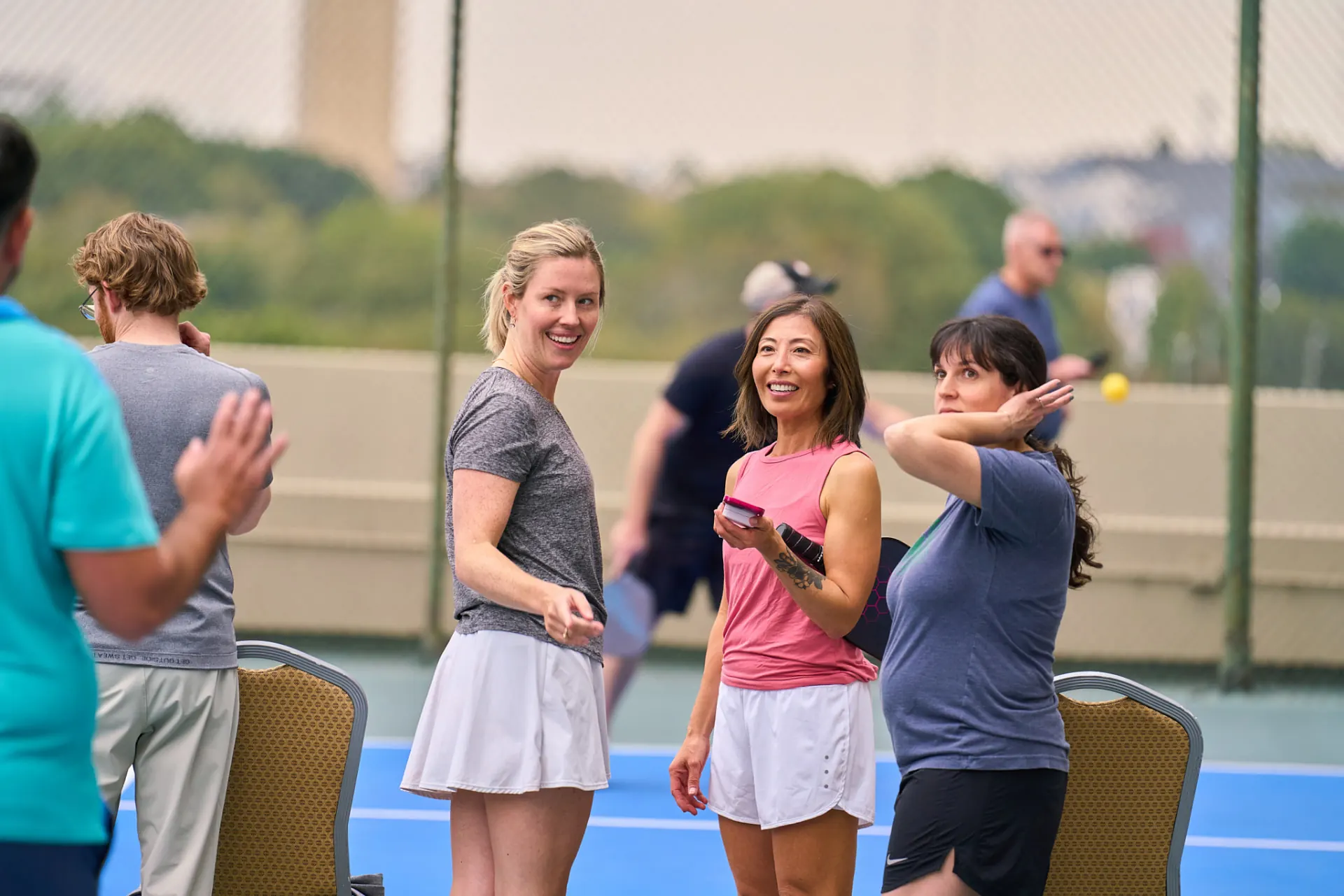 Serving up at a conference pickleball game