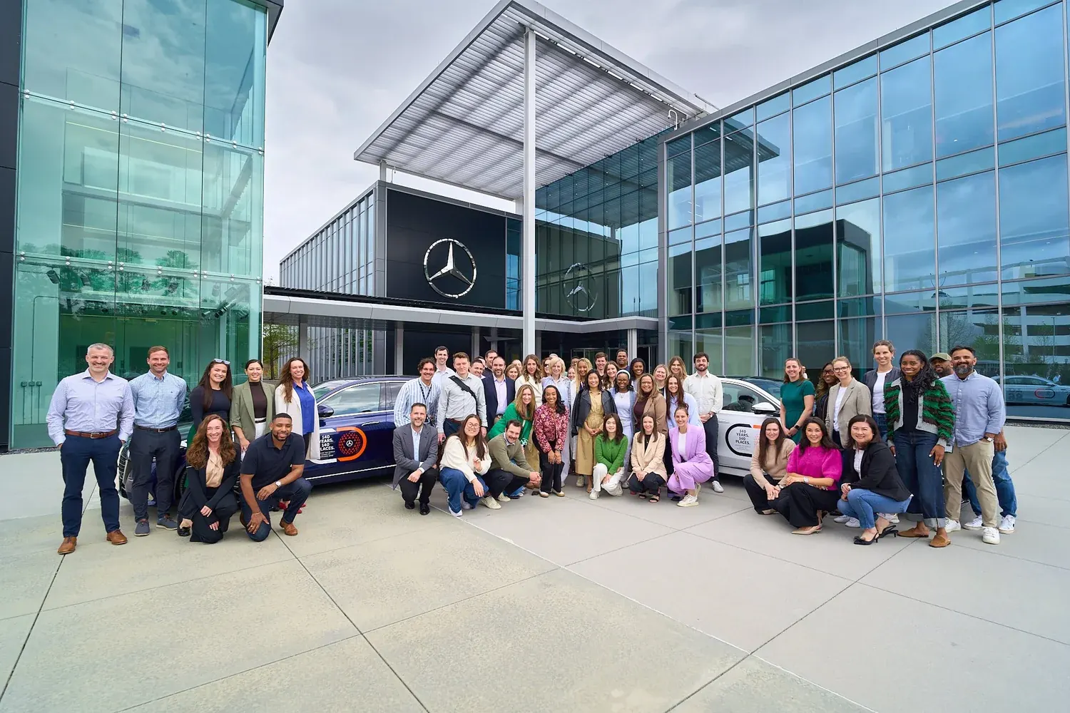 Large Mercedes-Benz team group photo outside their Atlanta facility for a corporate photography session