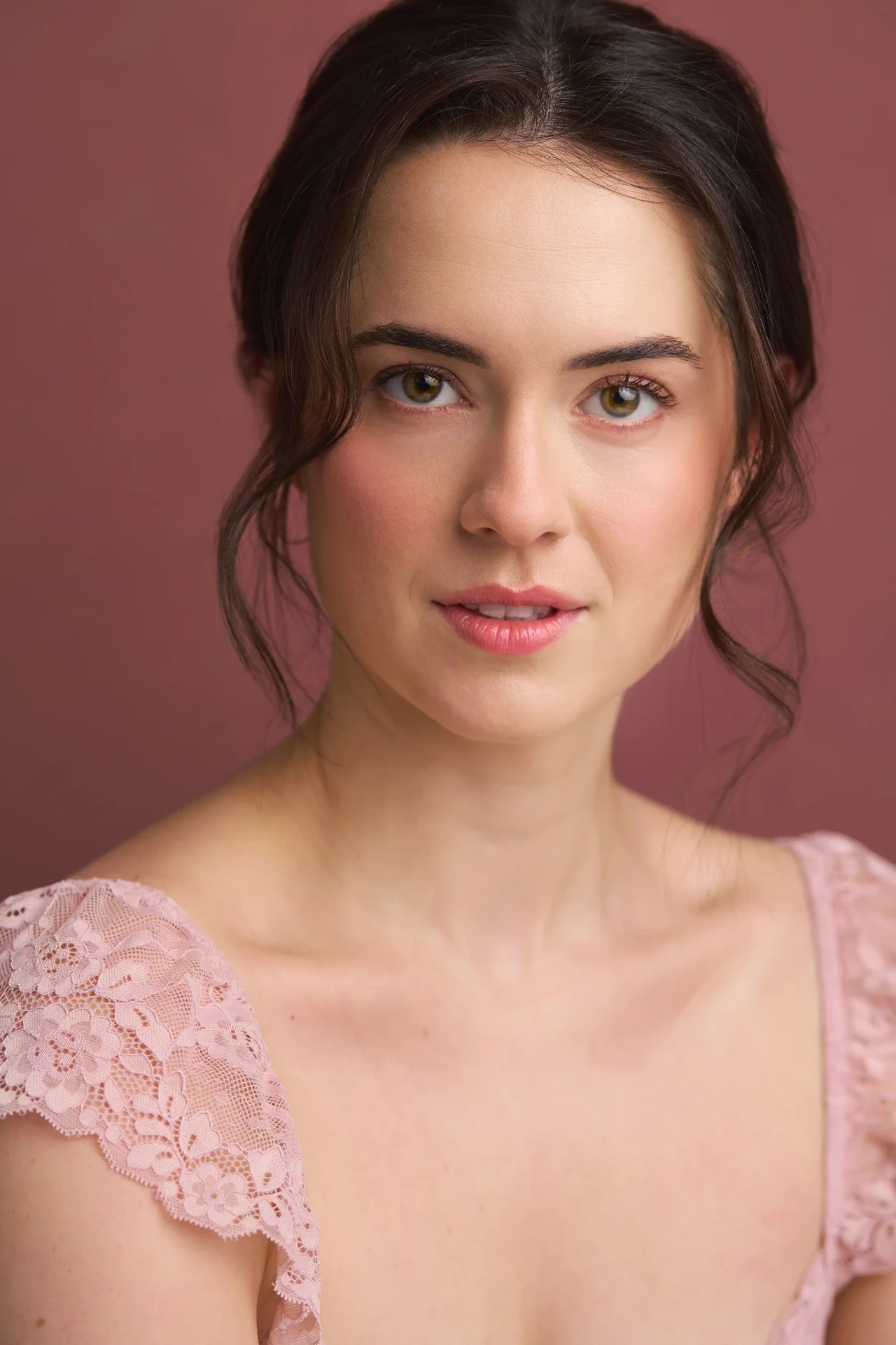 Editorial actor headshot of actress in pink lace on a mauve backdrop, photographed by an Atlanta actor headshot photographer