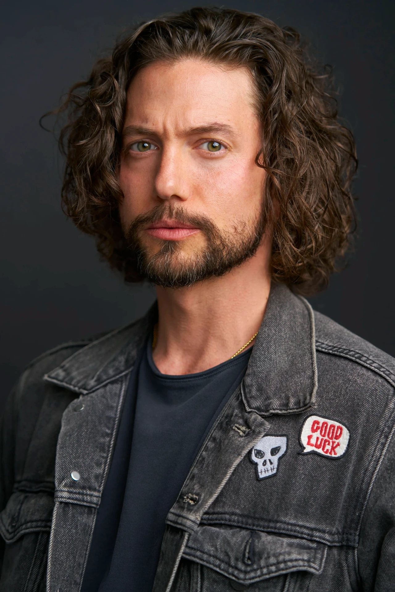Editorial actor headshot of long-haired actor in a gray denim jacket, photographed by an Atlanta actor headshot photographer