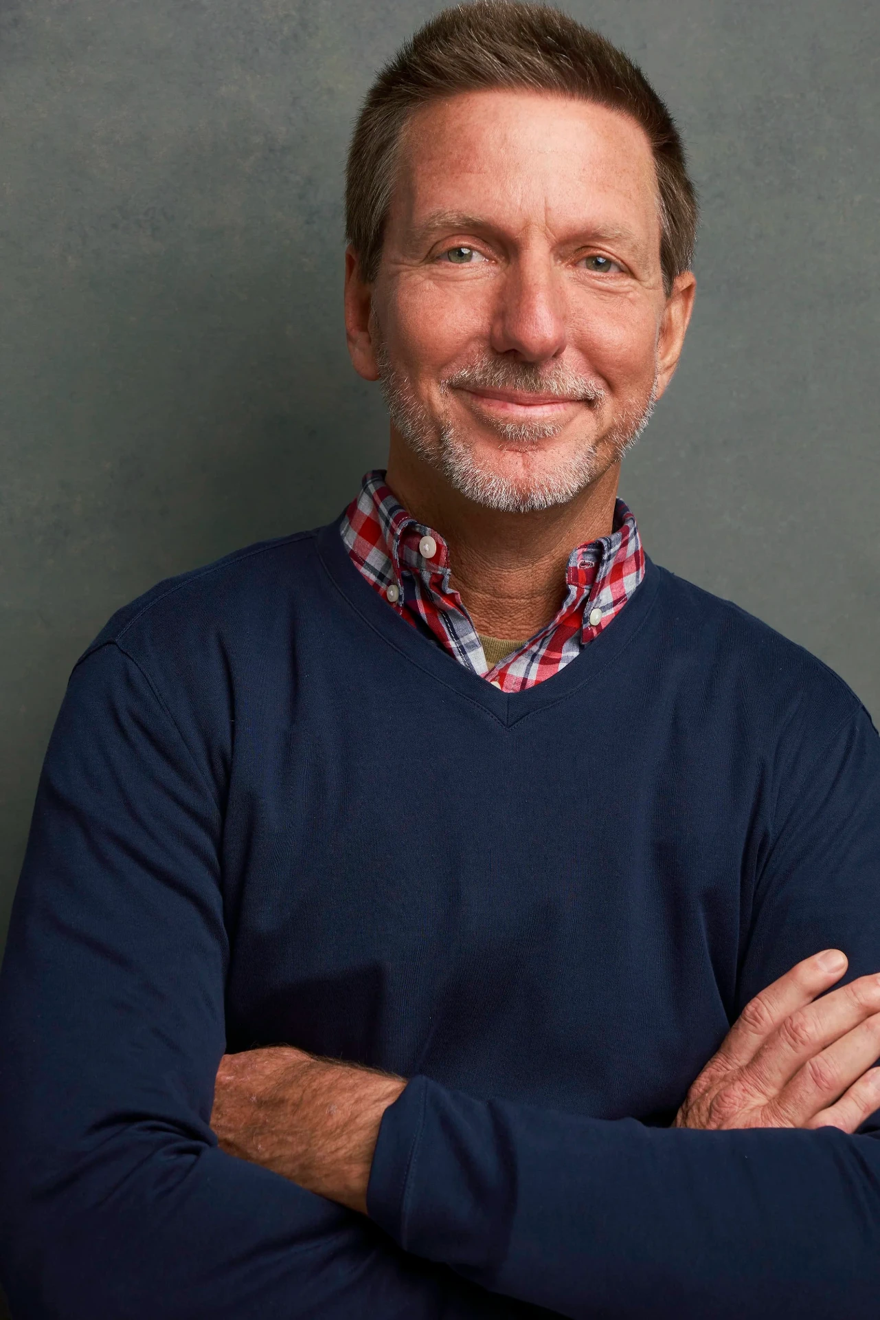 Editorial actor headshot of mature actor in a navy sweater with arms crossed, photographed by an Atlanta actor headshot photographer