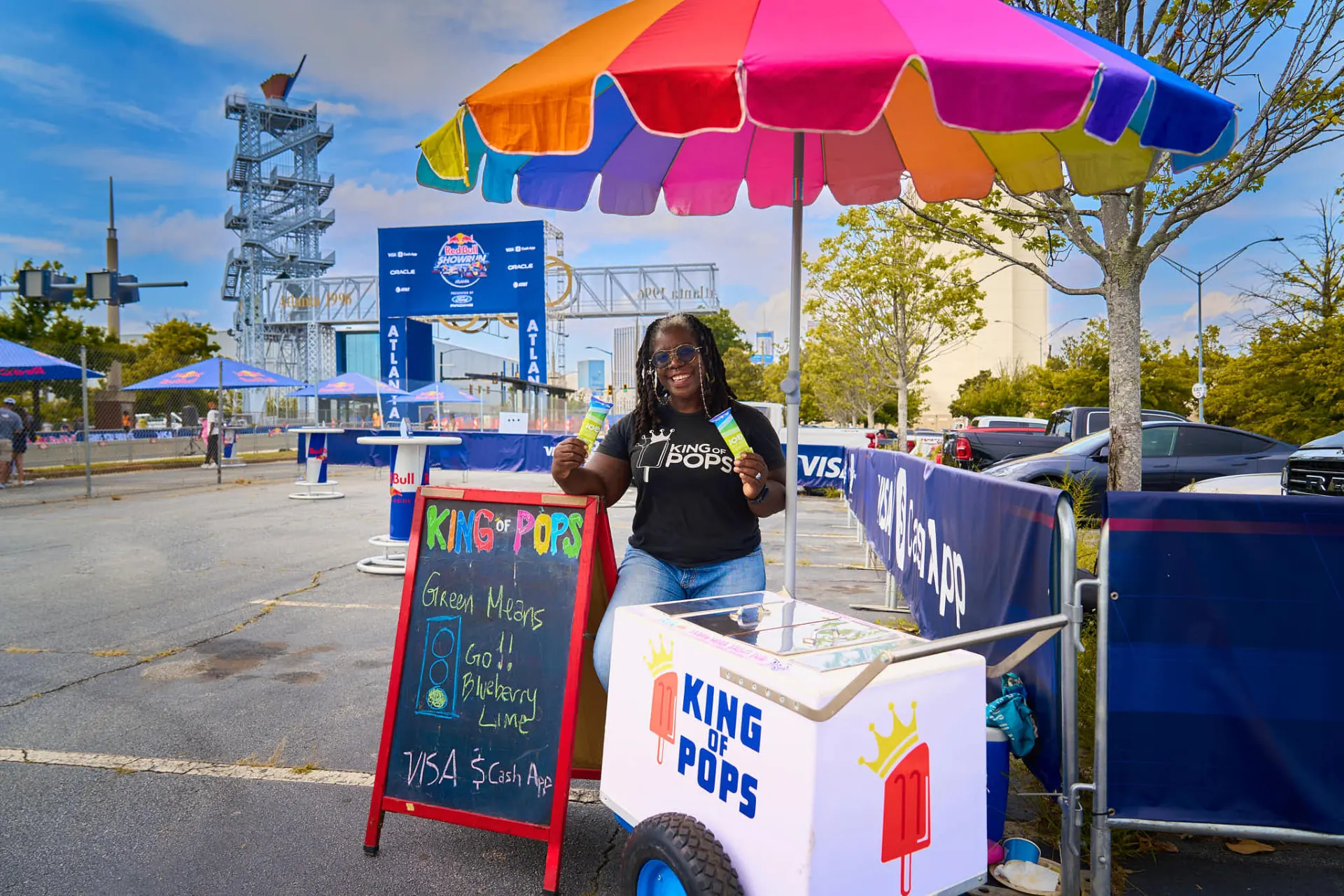Attendee trying a racing simulator at a brand activation in Atlanta, photo 2