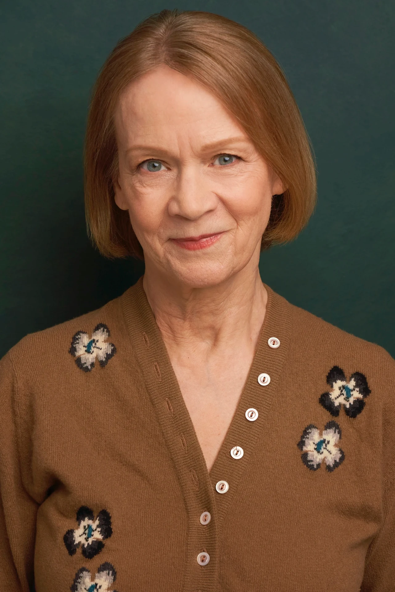Editorial actor headshot of mature actress in a floral cardigan, photographed by an Atlanta actor headshot photographer