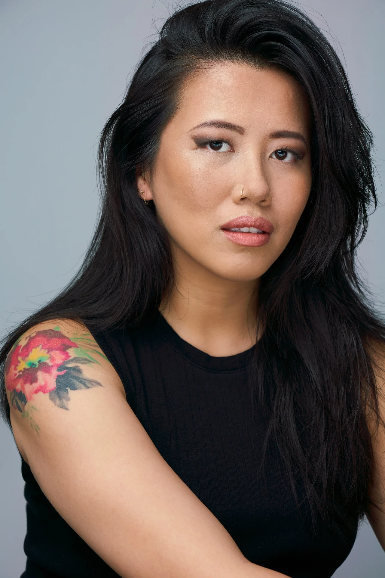 Editorial actor headshot of actress with a floral tattoo in a black tank, photographed by an Atlanta actor headshot photographer